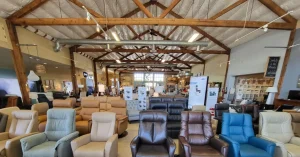 Recliners on the SC41 showroom floor in various colors and finishes from fabric to luxury leather, blue, green, brown, beige, tan, and black.