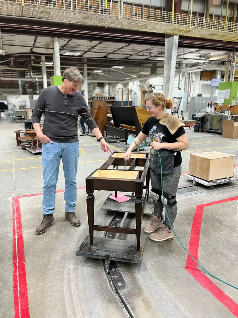 Gat creek owner and craftswoman on factory floor
