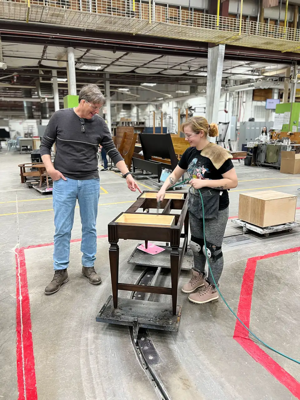 Gat creek owner and craftswoman on factory floor