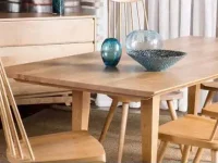 DS11 - Coordinated warm wooden dining table set with spindle-backed chairs in front of wooden buffet