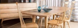 DS11 - Coordinated warm wooden dining table set with spindle-backed chairs in front of wooden buffet