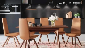 DS13 - Caramel-colored upholstered dining chairs with slender wooden legs in a contemporary style