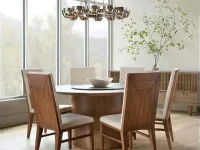 DS9 - Circular wood tabletop with angular wooden chairs under a modern chandelier beside a large window