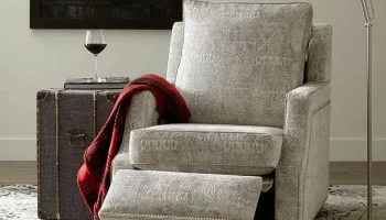 Norwalk Kobe power recliner in grey fabric upholstered scooper track arms armchair with nail-head trim and wall hugging design