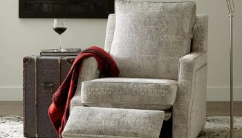 Norwalk Kobe power recliner in grey fabric upholstered scooper track arms armchair with nail-head trim and wall hugging design