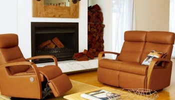 Tan leather wood armed power recliner and power reclining loveseat