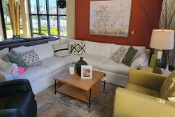 LR5SR - White sectional black leather recliner and yellow fabric armchair