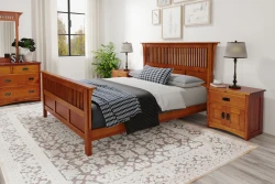 Arts and Crafts mission bedroom collection with slatted headboard bed dresser and nightstands in cherry finish paired with plaid bedding and botanical art