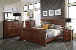 Contemporary Shaker bedroom set in brown cherry featuring panel bed tall dresser and curved nightstands with chrome hardware and geometric black white artwork