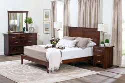 Contemporary Shaker panel bed in dark cherry featuring clean lines dresser with mirror nightstands and swing arm lamps with geometric pattern rug