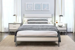 Contemporary solid wood bedroom set queen bed with two-tone gray-white panel headboard, matching nightstands, chrome lamps, and blue artwork trio above
