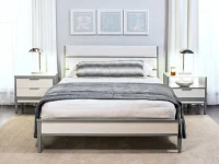 Contemporary solid wood bedroom set queen bed with two-tone gray-white panel headboard, matching nightstands, chrome lamps, and blue artwork trio above