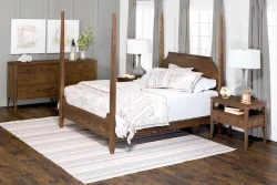 Dark stained four-poster bed with high headboard and low footboard matching nightstands and dresser, finished in the same rich, medium-dark wood