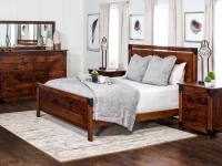 Industrial modern panel bed set in distressed pine featuring metal corner brackets dresser and nightstands with vintage style lamps and nature inspired artwork
