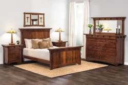 Mission style bedroom suite in brown oak featuring panel bed matching nightstands and dresser with table lamps and stained glass wall art
