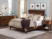 Modern farmhouse panel bed set in rustic brown maple featuring tapered leg dresser nightstands with industrial lamps birds nest artwork and plaid bedding