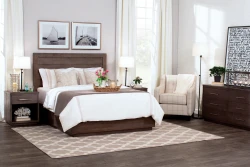 Modern platform bed set in espresso featuring floating base panel headboard dresser and nightstands with nautical artwork and geometric pattern rug