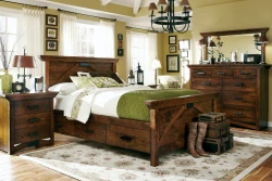 Rustic craftsman storage bedroom set in distressed pine featuring panel bed with footboard drawers matching case pieces iron hardware and sage accents