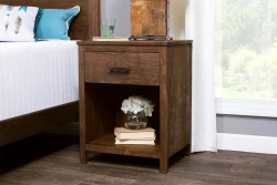 Rustic wooden nightstand with single drawer hardware pull featuring open shelf storage space decorated with white hydrangeas and stacked books