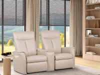 Cream leather two-seat H2 Seating power recliner love seat with tufted backrests plush armrests, and integrated footrests featuring a central console with cup holders