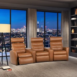 Tan leather three-seat H2 Seating power reclining sofa with tufted backrests, plush armrests, and built-in footrests, featuring two central consoles with cup holders and storage