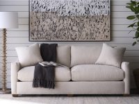 Rowe - Beige Fabric Sofa With Throw Blanket Under Abstract Art Near Wooden Floor Lamp