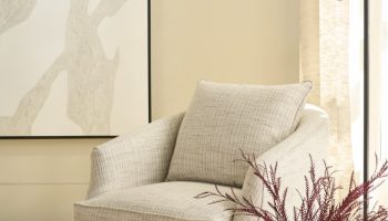 Rowe - Beige Patterned Armchair With Plush Cushions Near Floor Lamp, White Vase, Books, Under Abstract Art, Home Decor