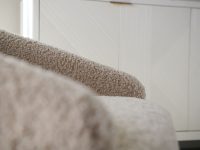 Rowe - Beige Shaggy Armchair With Plush Upholstery Near White Geometric Ribbed Panel Doors Home Decor