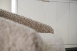 Rowe - Beige Shaggy Armchair With Plush Upholstery Near White Geometric Ribbed Panel Doors Home Decor