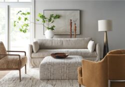 Rowe - Beige Slipcover Sofa With Patterned Ottoman And Brown Armchairs In Modern Living Room With Home Decor
