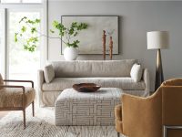 Rowe - Beige Slipcover Sofa With Patterned Ottoman And Brown Armchairs In Modern Living Room With Home Decor