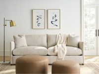 Rowe - Beige Sofa With Plush Cushions And Throw Blanket, Two Brown Ottomans, Under Wall Art, Home Decor