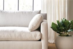 Rowe - Beige Sofa With Plush Cushions Near Large Window With White Curtains And Potted Plant Home Decor