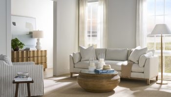 Rowe - Beige Sofa With Plush Cushions Near Wooden Coffee Table Under Large Window Home Decor