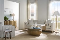 Rowe - Beige Sofa With Plush Cushions Near Wooden Coffee Table Under Large Window Home Decor