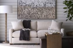 Rowe - Beige Sofa With Throw Blanket Under Abstract Art Near Wooden Coffee Table Home Decor