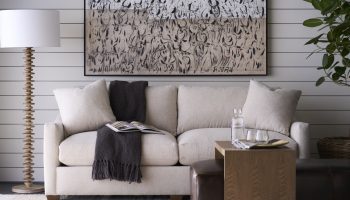 Rowe - Beige Sofa With Throw Blanket Under Abstract Art Near Wooden Coffee Table Home Decor