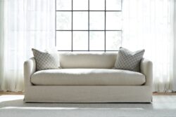Rowe - Beige Sofa With Two Checkered Pillows In Front Of Large Window Home Decor Upholstery