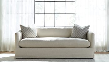 Rowe - Beige Sofa With Two Checkered Pillows In Front Of Large Window Home Decor Upholstery