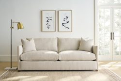 Rowe - Beige Sofa With Two Pillows Under Framed Art Near Floor Lamp And Large Window, Home Decor
