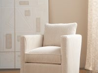 Rowe - Beige corduroy armchair with plush cushions, placed on a beige rug near a large abstract artwork and light curtains