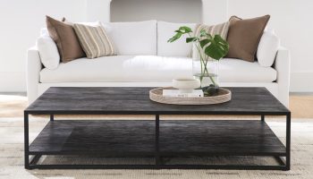 Rowe - Black Coffee Table With Lower Shelf On Light Rug In Front Of White Sofa With Brown And Beige Cushions