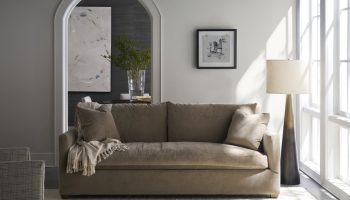 Rowe - Brown Fabric Sofa With Plush Cushions And Throw Blanket Near Floor Lamp In Modern Living Room