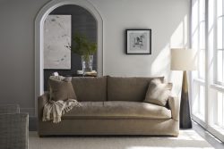 Rowe - Brown Fabric Sofa With Plush Cushions And Throw Blanket Near Floor Lamp In Modern Living Room