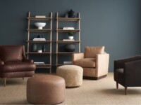 Rowe - Brown Leather Armchairs And Ottomans With Wooden Console Table And Decor Against Teal Wall
