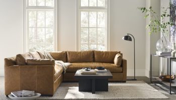 Rowe - Brown Leather Sectional Sofa With Plush Cushions And Coffee Table In Modern Living Room Near Large Windows