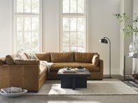 Rowe - Brown Leather Sectional Sofa With Plush Cushions And Coffee Table In Modern Living Room Near Large Windows