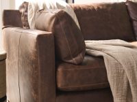 Rowe - Brown Leather Sofa With Plush Cushions And Throw Blanket Near Large Window