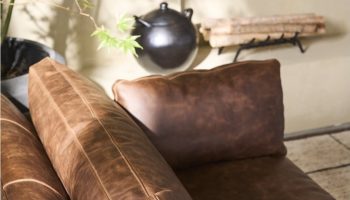 Rowe - Brown Leather Sofa With Plush Cushions Near Plant Under Wall Decor Home Furniture