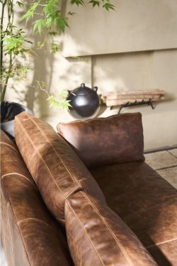 Rowe - Brown Leather Sofa With Plush Cushions Near Plant Under Wall Decor Home Furniture